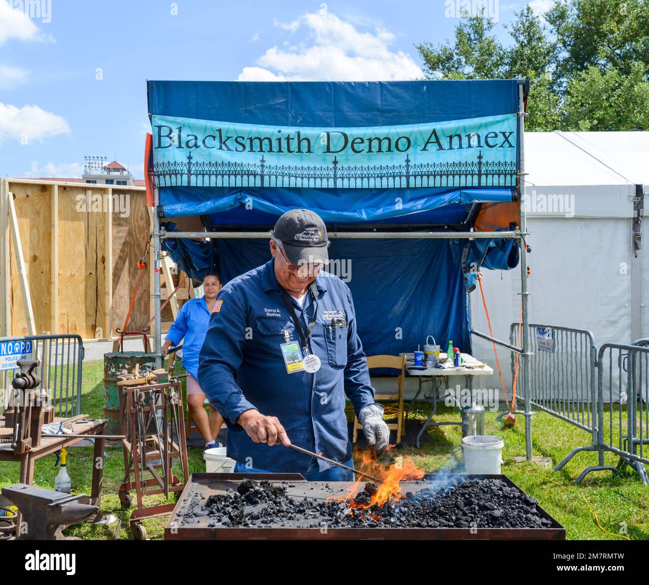 NEW ORLEANS, LA, USA - APRIL 29, 2022: Blacksmith demonstrates toolmaking at the Blacksmith Demo Area at the New Orleans Jazz and Heritage Festival Stock Photo