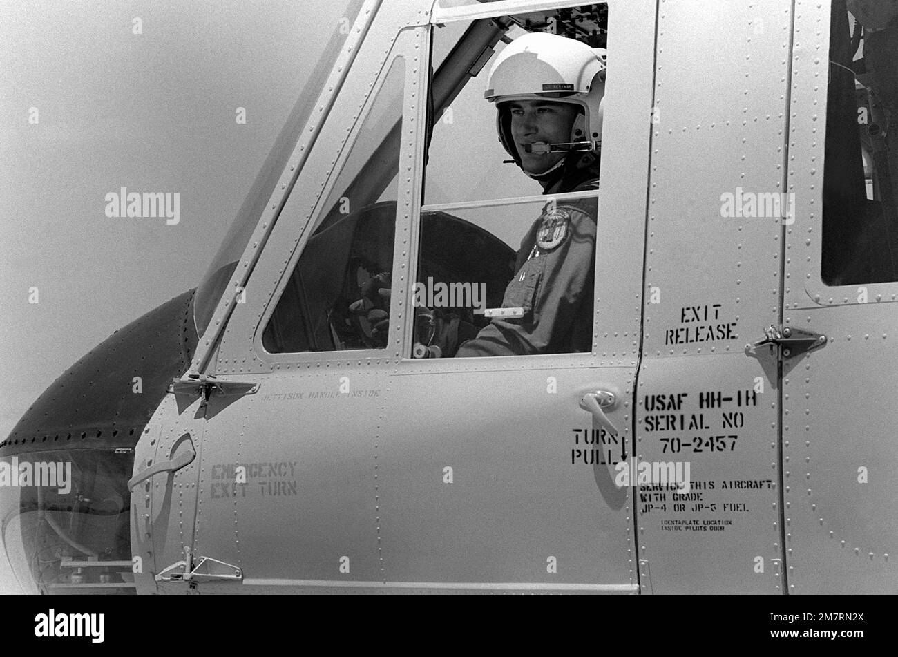 Lt kim f p skrinak is aboard an hh 1h iroquois helicopter before take