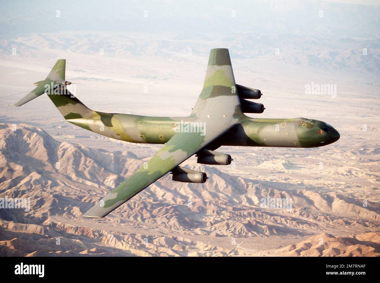 AN air-to-air right front view of a C-141B Starlifter aircraft with the ...