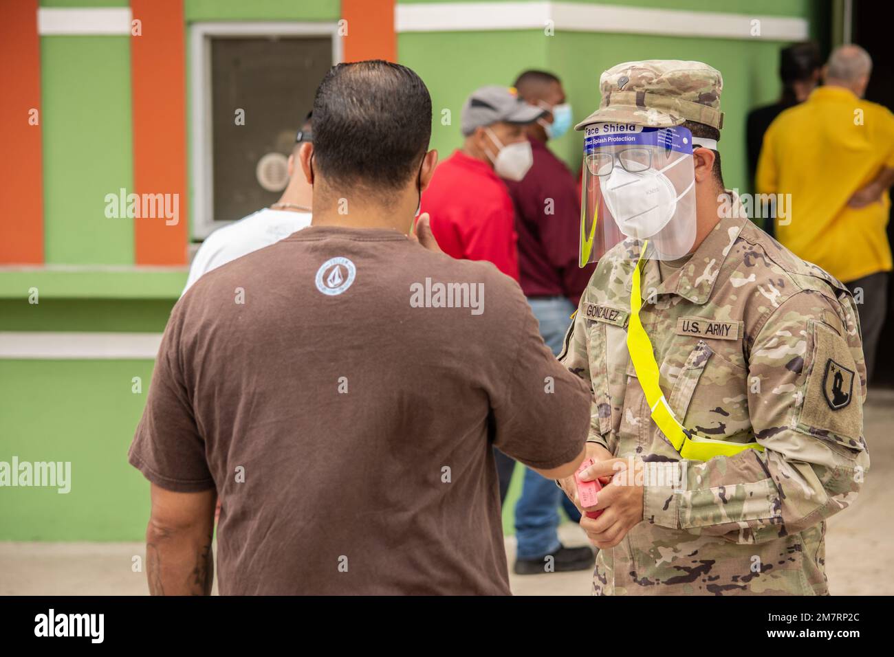 Spc. Isaac González of the Joint Task Force Puerto Rico speaks with a citizen in Cayey, Puerto