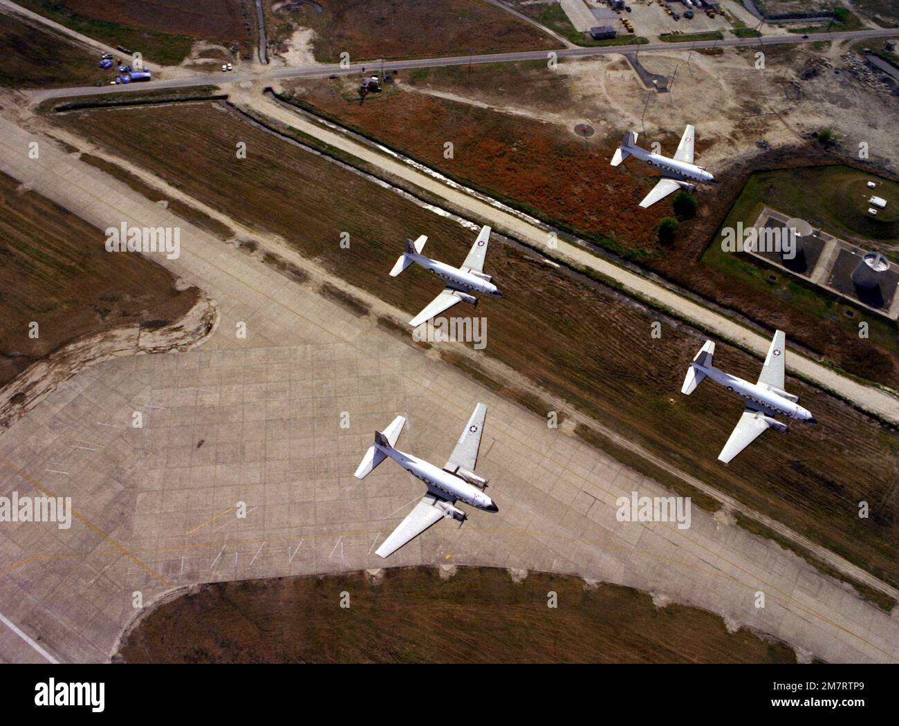 An air to ground view of four Marine C-117 aircraft as they fly over ...