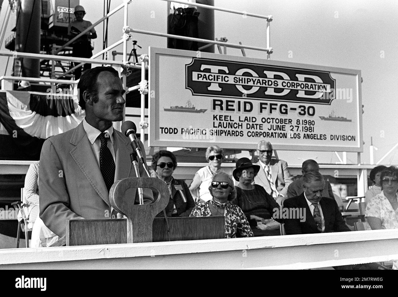 Representative Barry M. Goldwater Jr., Republican-Arizona, speaks during christening and launching ceremonies for the guided missile frigate USS REID (FFG 30) at the Todd Pacific Shipyards Corp., Los Angeles Division. Base: Long Beach State: California (CA) Country: United States Of America (USA) Stock Photo