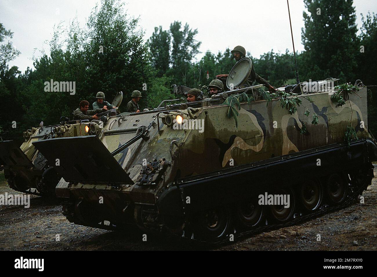 Soldiers aboard an M-113 armored personnel carrier prepare to move out in field practice during Exercise Sentry Castle '81. The soldiers are assigned to the 42nd Infantry Division, U.S. Army. Subject Operation/Series: SENTRY CASTLE '81 Base: Fort Drum State: New York (NY) Country: United States Of America (USA) Stock Photo
