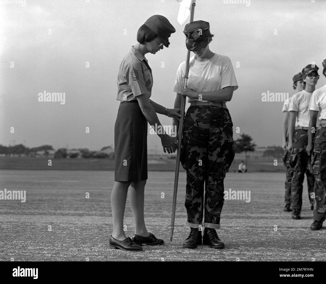 MASTER SGT. Hurlburt, chief drill instructor, shows a female marine