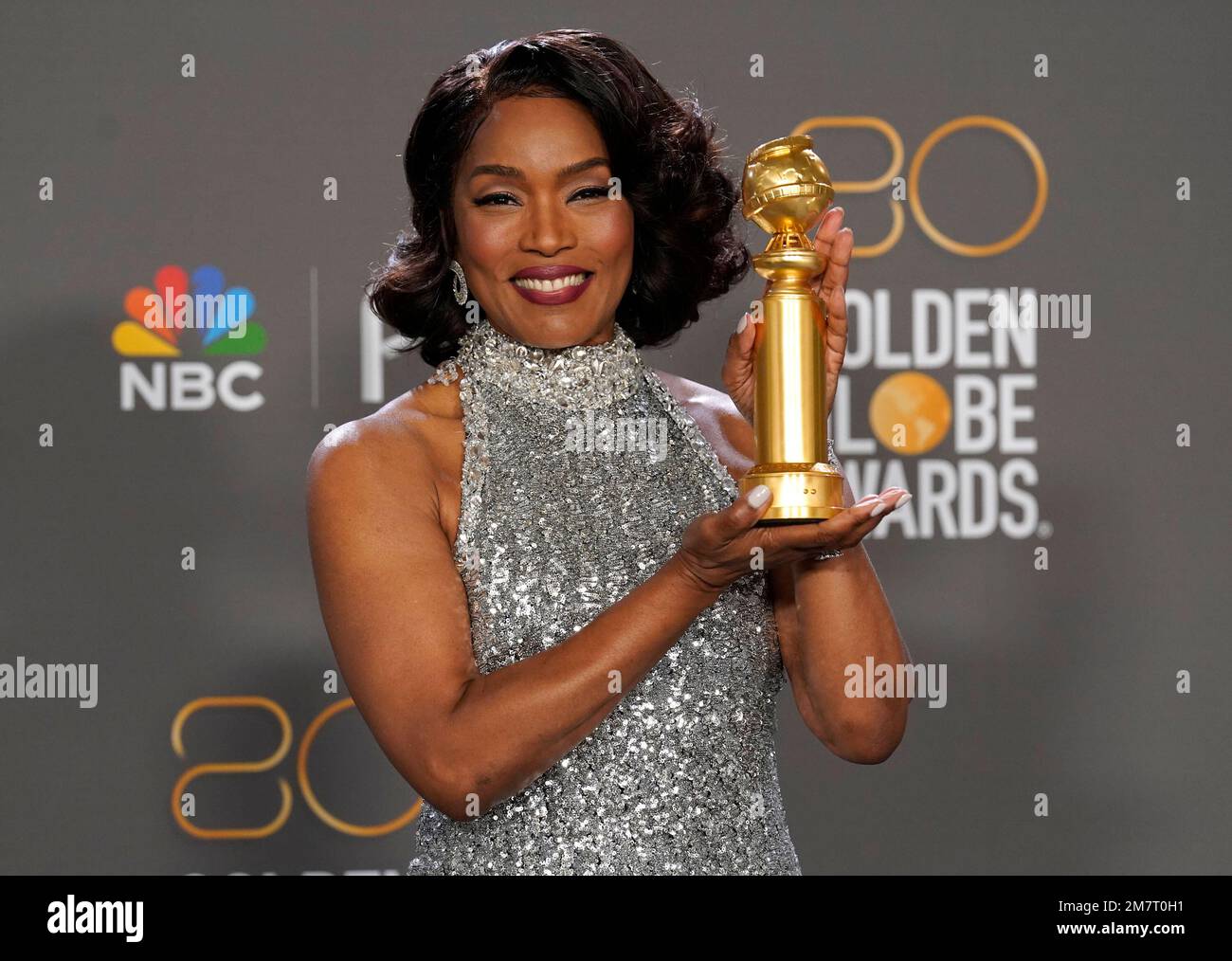Angela Bassett poses in the press room with the award for best ...