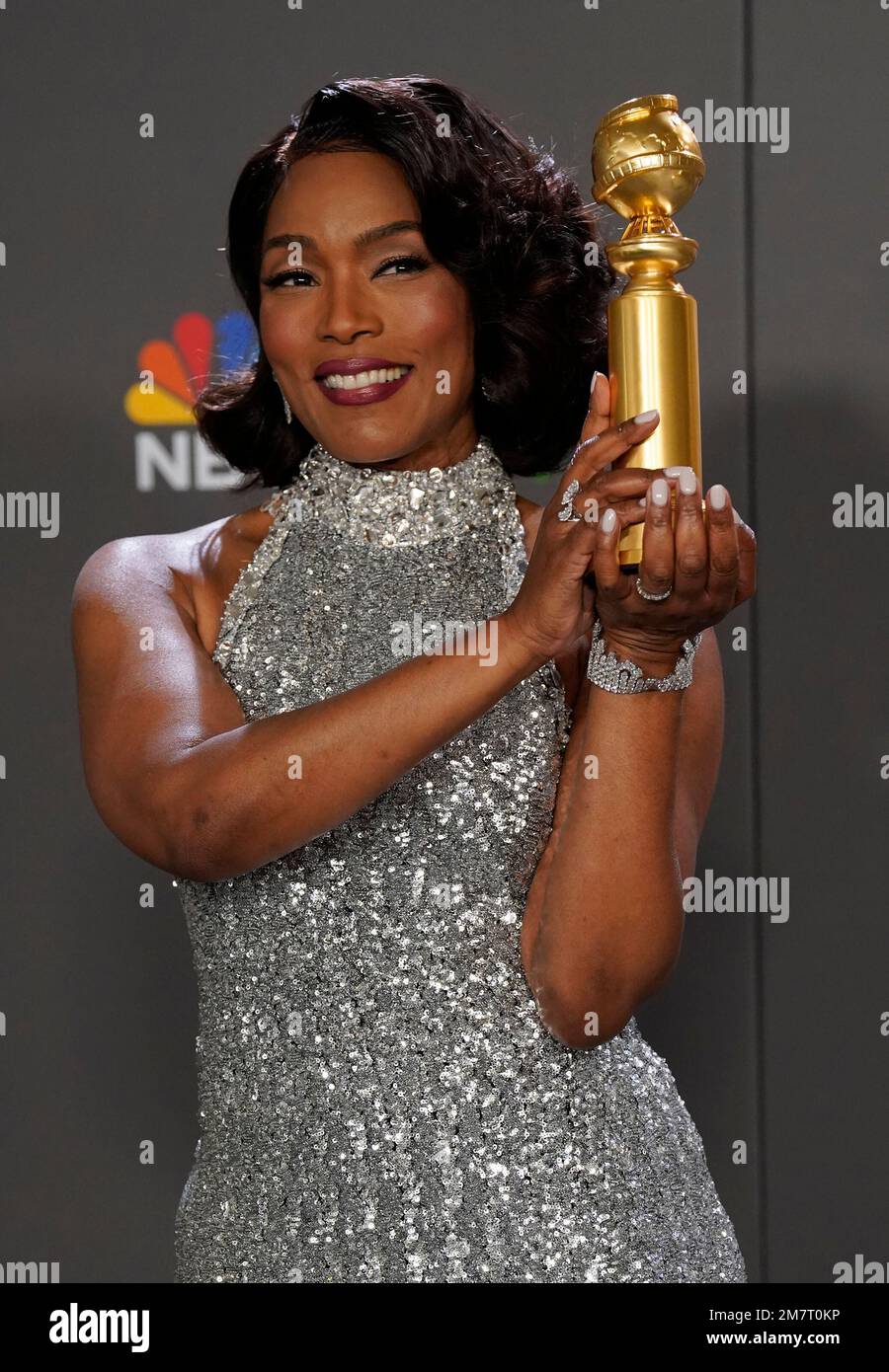 Angela Bassett poses in the press room with the award for best ...