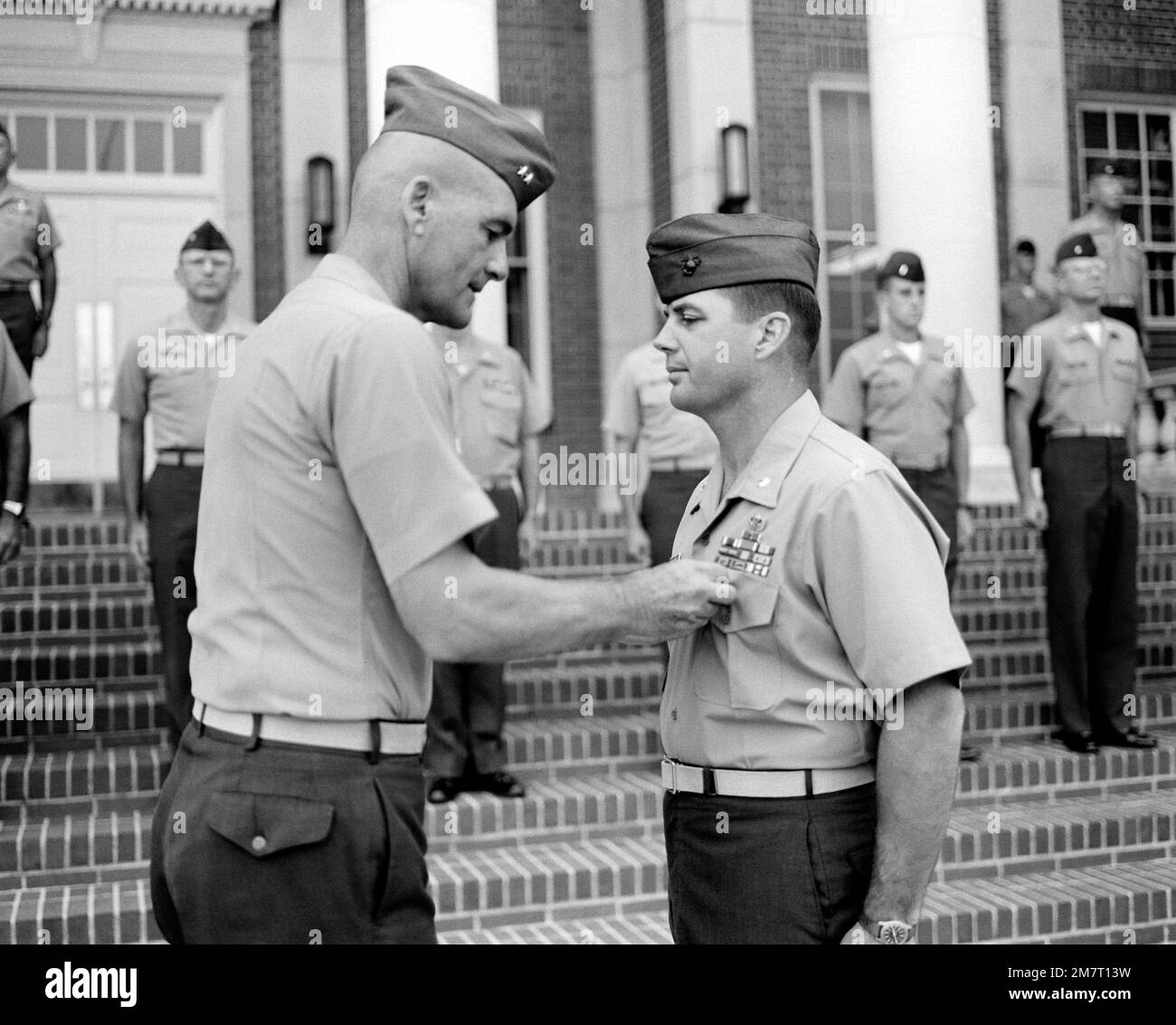 MGEN Robert E. Haebel, commanding general, Marine Corps Recruit Depot, presents the Meritorious Service Medal to LTC J. VanDyne for his outstanding service as head of recruiting operations. The ceremony was held during the morning colors. Base: Usmc Recruit Depot,Parris Island State: South Carolina (SC) Country: United States Of America (USA) Stock Photo