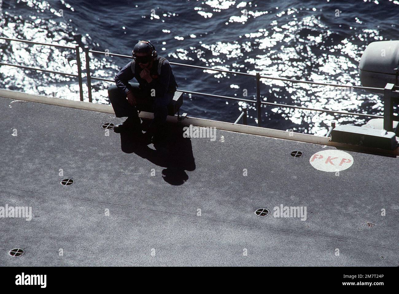 A flight deck crewman aboard the amphibious assault ship USS SAIPAN ...