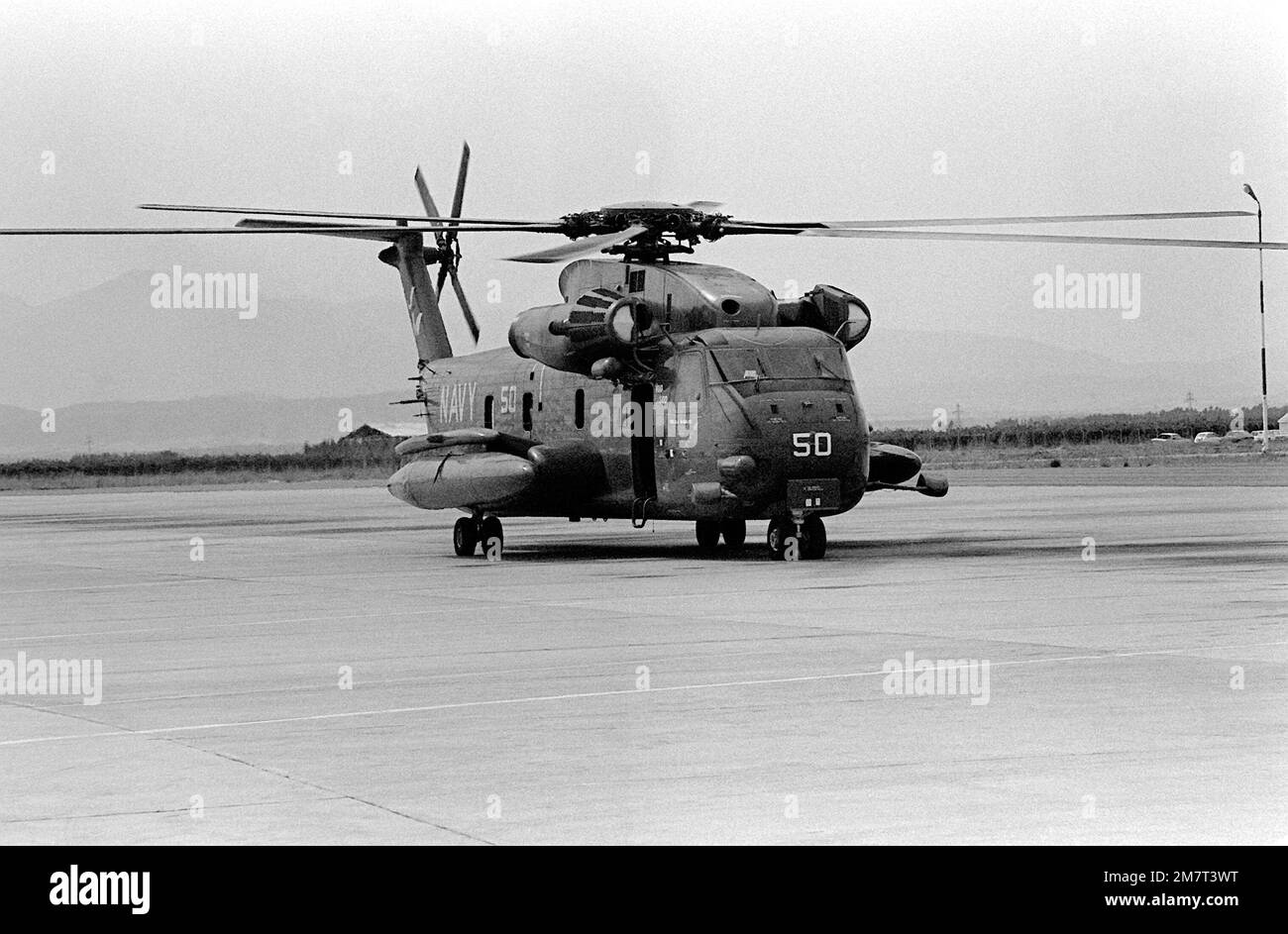 A right side view of an H-53 Sea Stallion helicopter on the flight deck of the nuclear-powered aircraft carrier USS NIMITZ (CVN-68) during the NATO exercise Display Determination '81. Subject Operation/Series: DISPLAY DETERMINATION '81 Country: Mediterranean Sea (MED) Stock Photo