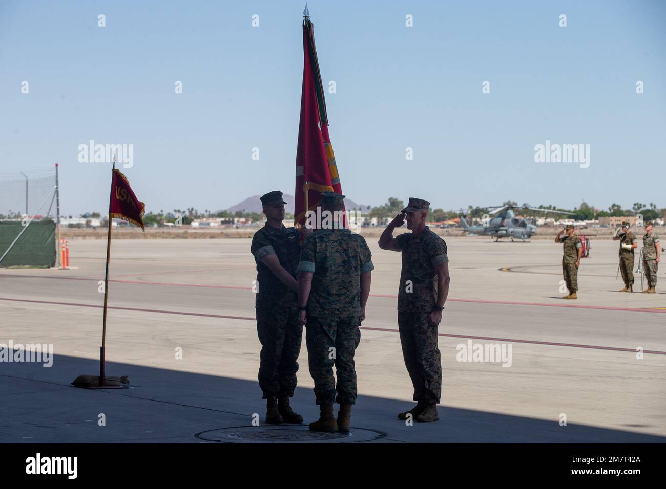 U.S. Marine Corps Col. Eric D. Purcell, left, incoming commanding officer of Marine Aviation Weapons and Tactics Squadron One (MAWTS-1), receives the unit colors from Col. Steve E. Gillette, outgoing commanding officer, during the MAWTS-1 Change of Command Ceremony at Marine Corps Air Station Yuma, Arizona on May 12, 2022. The MAWTS-1 Change of Command Ceremony marked the official passing of authority from the outgoing commanding officer, Col. Steve E. Gillette, to the incoming commanding officer, Col. Eric D. Purcell. Stock Photo
