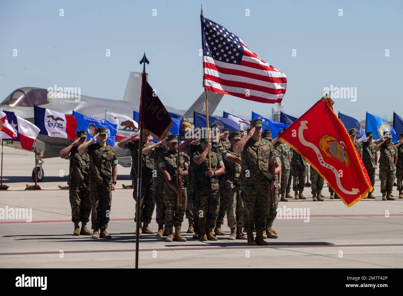 U.S. Marines assigned to Marine Aviation Weapons and Tactics Squadron One (MAWTS-1) and the incoming commanding officer, Col. Eric D. Purcell, salute the outgoing commanding officer of MAWTS-1, Col. Steve E. Gillette, during the Change of Command Ceremony at Marine Corps Air Station Yuma, Arizona on May 12, 2022. The MAWTS-1 Change of Command Ceremony marked the official passing of authority from the outgoing commanding officer, Col. Steve E. Gillette, to the incoming commanding officer, Col. Eric D. Purcell. Stock Photo