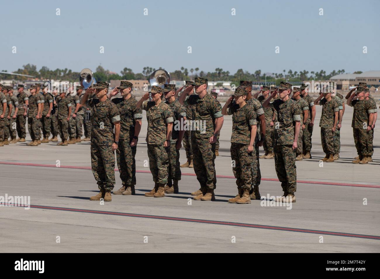U.S. Marines assigned to Marine Aviation Weapons and Tactics Squadron One (MAWTS-1), salute the incoming commanding officer of MAWTS-1, Col. Eric D. Purcell, during the Change of Command Ceremony at Marine Corps Air Station Yuma, Arizona, on May 12, 2022. The MAWTS-1 Change of Command Ceremony marked the official passing of authority from the outgoing commanding officer, Col. Steve E. Gillette, to the incoming commanding officer, Col. Eric D. Purcell. Stock Photo
