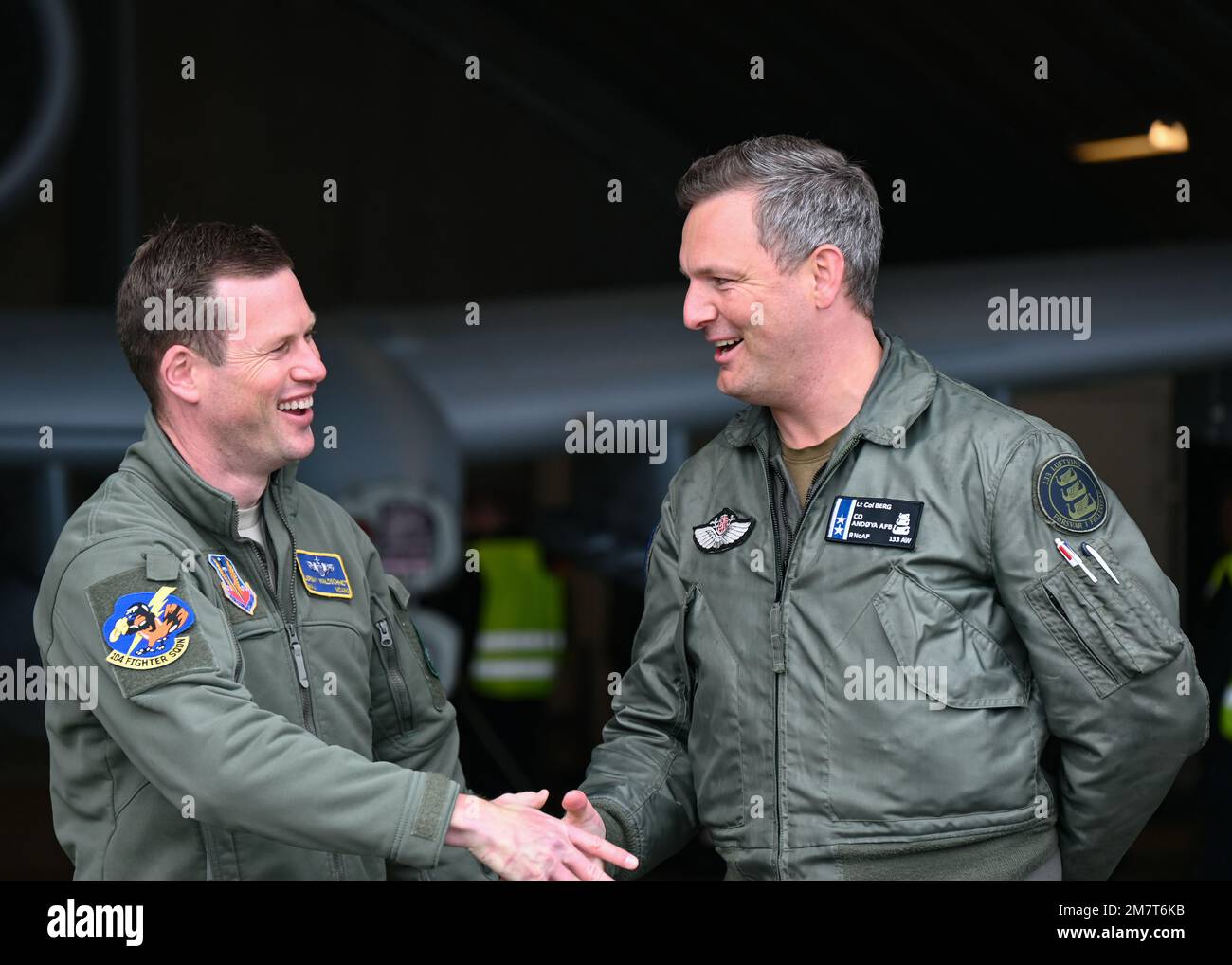 U.S. Air Force Maj. Jeremy Waldschmidt, an A-10 pilot assigned to the 104th Fighter Squadron, Maryland Air National Guard, and Lt. Col. Lasse Berg, base commander of Andoya Air Base, Andenes, Norway, shake hands during a tour of an A-10 Thunderbolt II aircraft, May 12, 2022 at Andoya Air Base, in Andenes, Norway. The MDANG is participating in the Swift Response exercise, an annual USAREUR-AF led multinational training exercise taking place throughout Eastern Europe, including the Arctic, Baltic Sea, and the Balkan Peninsula regions and is designed to enhance readiness and airborne interoperabi Stock Photo