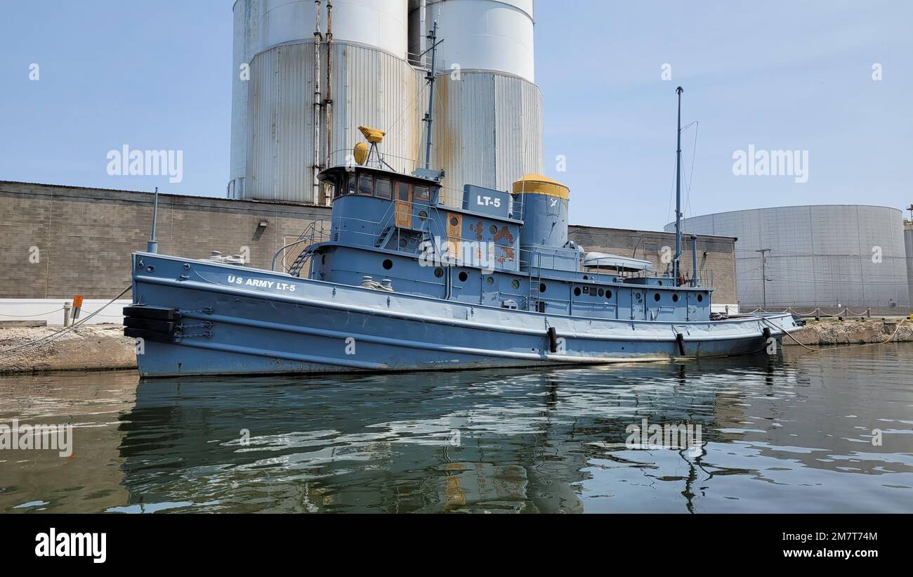 The former U.S. Army Transport LT-5, a large tugboat originally named the “Major Elisha K. Henson” sits docked at the H. Lee White Marine Museum in Oswego, New York, May 12, 2022. The LT-5 – now a National Historic Landmark – was built in 1943 in Oyster Bay, New York, served in the European Theater of WWII, was transferred to the U.S. Army Corps of Engineers, Buffalo District in 1946 and renamed the Nash, and was laid up and excessed to the museum in Spring 1989. Stock Photo