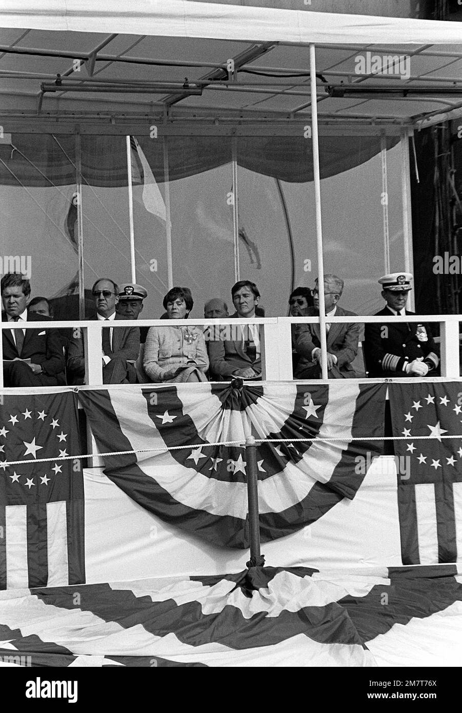 Secretary of the Navy John F. Lehman Jr., center, and Joan Clark, wife