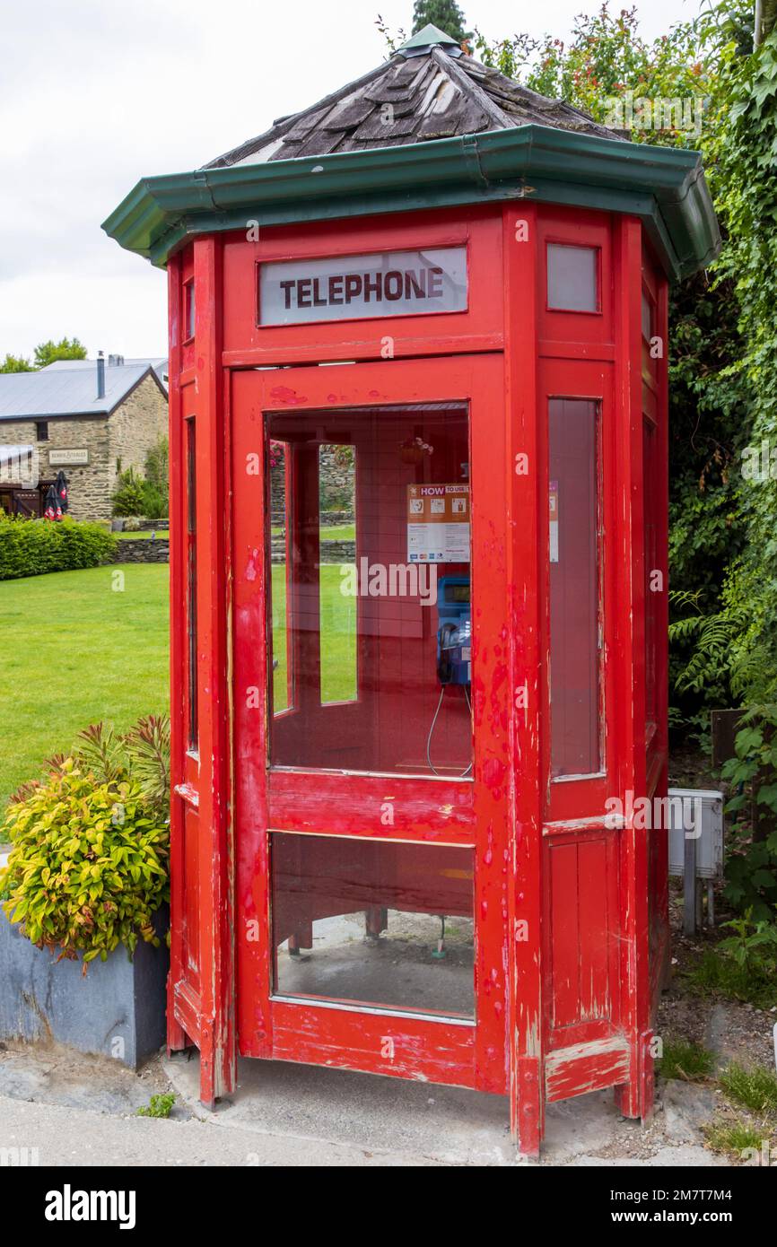 Old red telephone kiosk, Arrowtown, New Zealand, Tuesday, December 27, 2022. Stock Photo