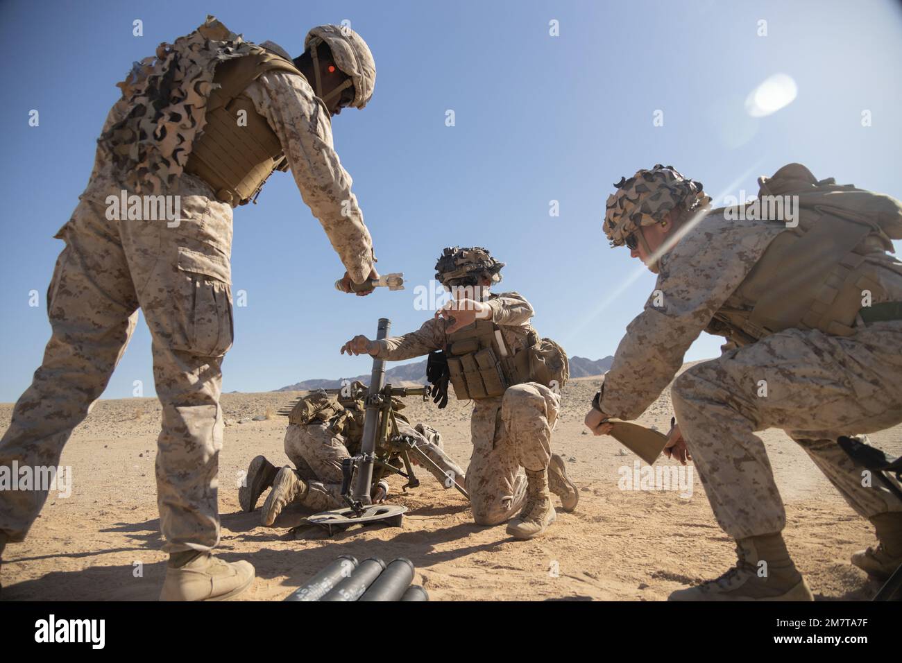 U.S. Marines with Charlie Company, 1st Battalion, 7th Marine Regiment, 1st Marine Division fire a M224 60 mm mortar system during a digital kill chain exercise at Marine Corps Air Ground Combat Center, Twentynine Palms, California, May 12, 2022. During the exercise, the Marines tested new digital target acquisition equipment for the M224 60 mm mortar system and the Mark 19 40 mm grenade machine gun. Stock Photo