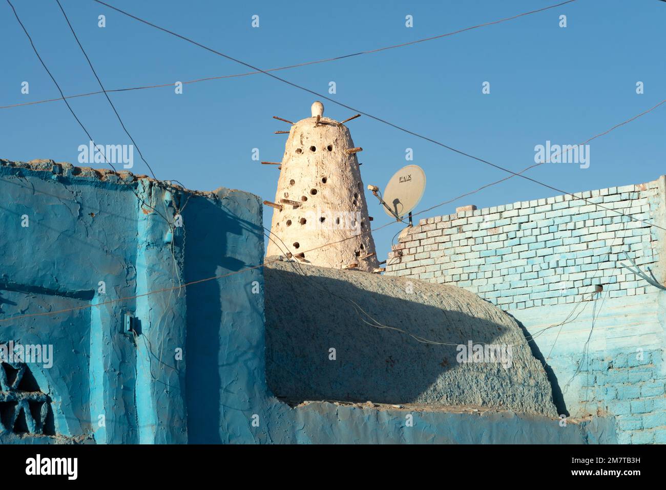 Aswan, Egypt. December 10th 2022 Blue Nubian architecture and traditional style Dovecote or mud brick Pigeon House used to raise and farm pigeons, pop Stock Photo