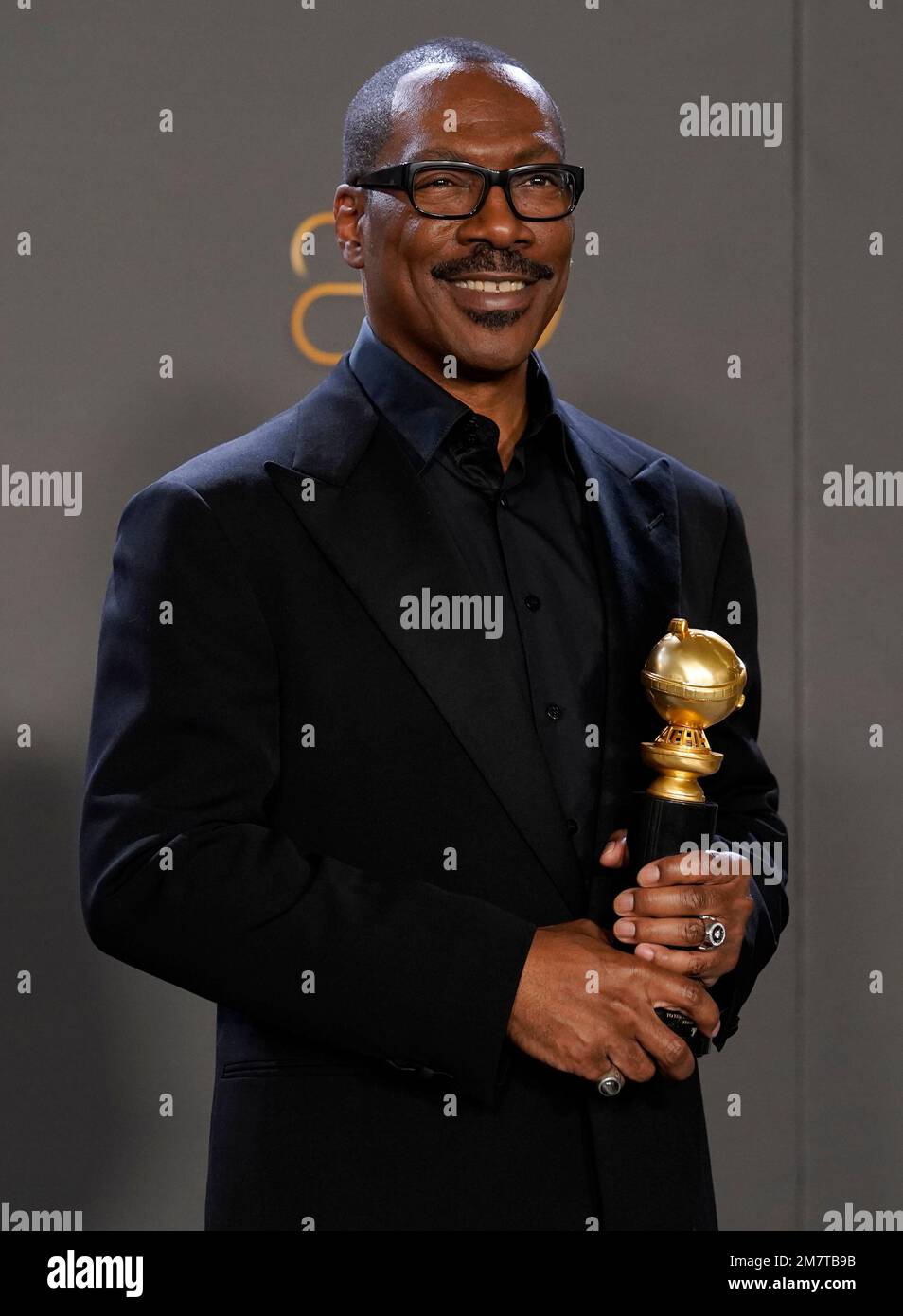 Eddie Murphy poses with the Cecil B. DeMille award at the 80th annual