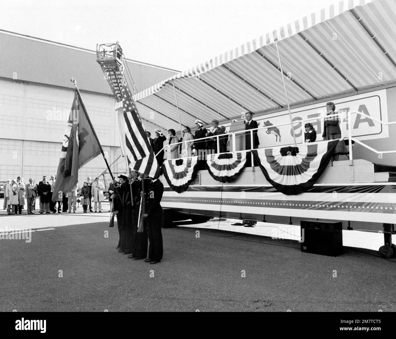 The color guard from Naval Support Activity Seattle presents the colors at the launching of the guided missile patrol combatant (hydrofoil) ARIES (PHM-5) as distinguished guests stand on the speakers platform. Included on the platform are: Boeing Marine Systems Vice President Robert E. Bateman, at podium, and VADM Earl B. Fowler Jr., second person to the left of the podium, commander, Naval Sea Systems Command. Base: Renton State: Washington (WA) Country: United States Of America (USA) Stock Photo