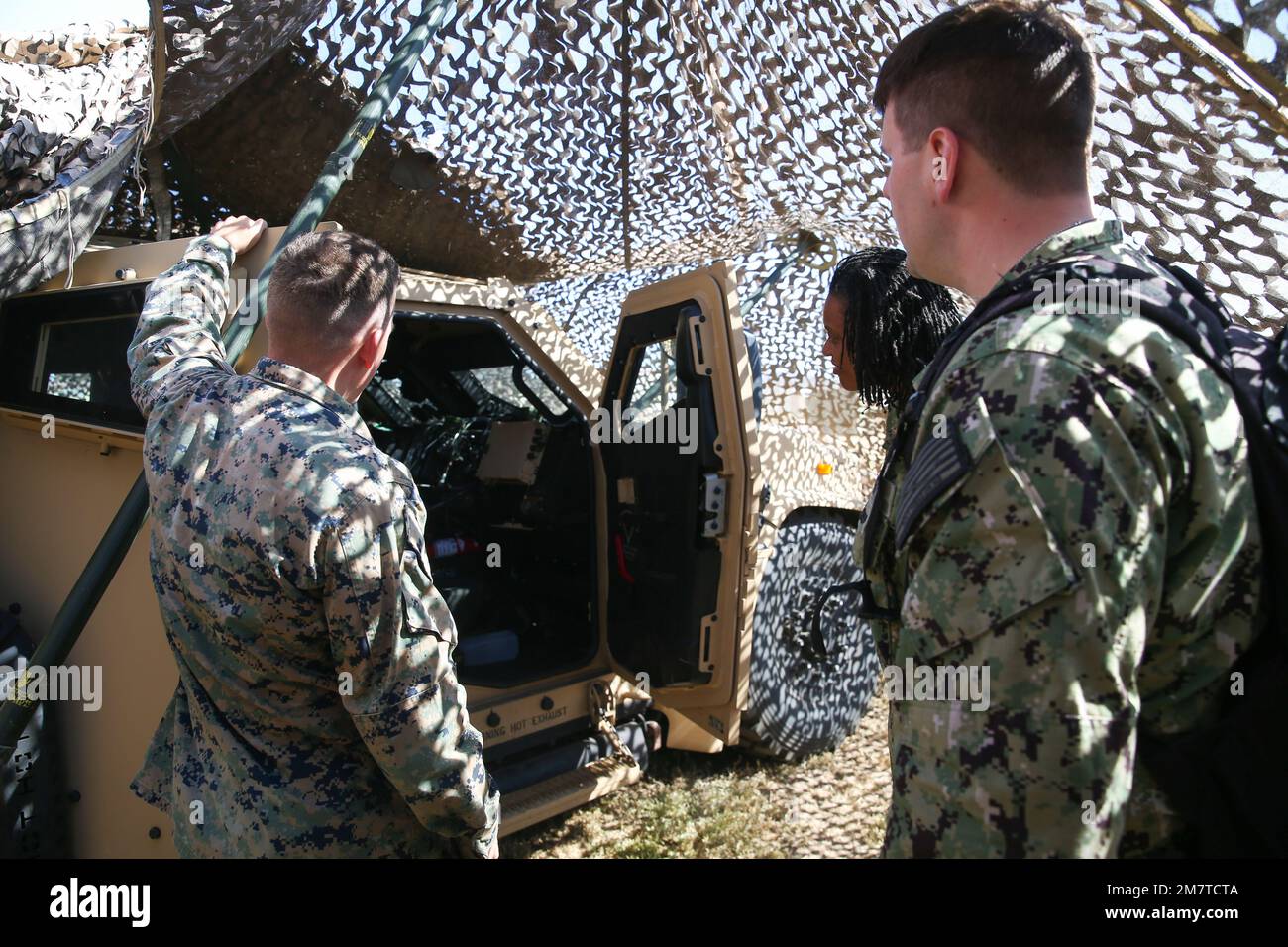 U.S. Marine Corps Lt. Sean Authelet, left, communications section