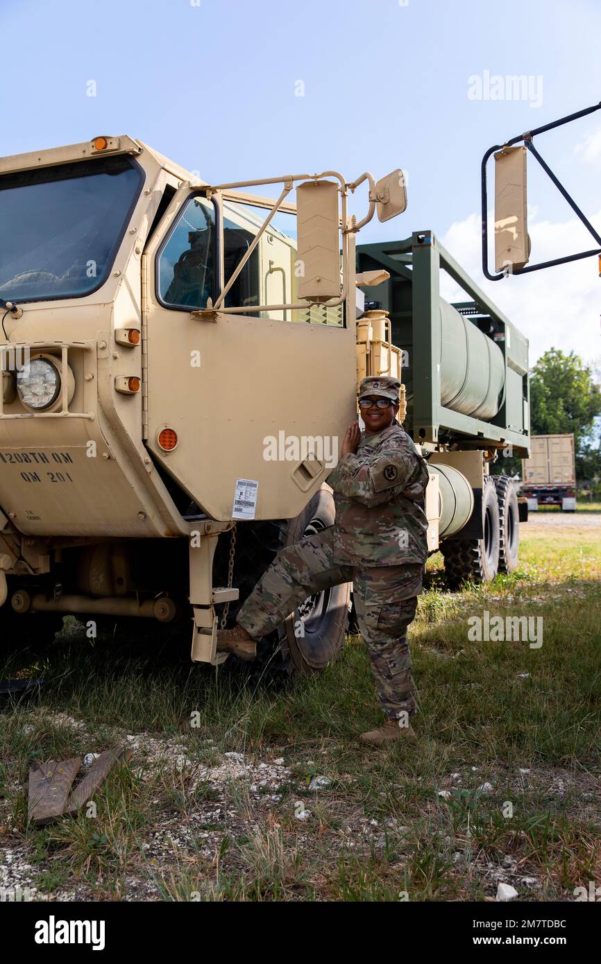 Alabama Army National Guard Sgt. 1st Class Veronica O'Neal opens the door  to the HIPPO water tank truck at Price Barracks, Belize on May 13, 2022. O' Neal and the 1208th Quartermaster Company