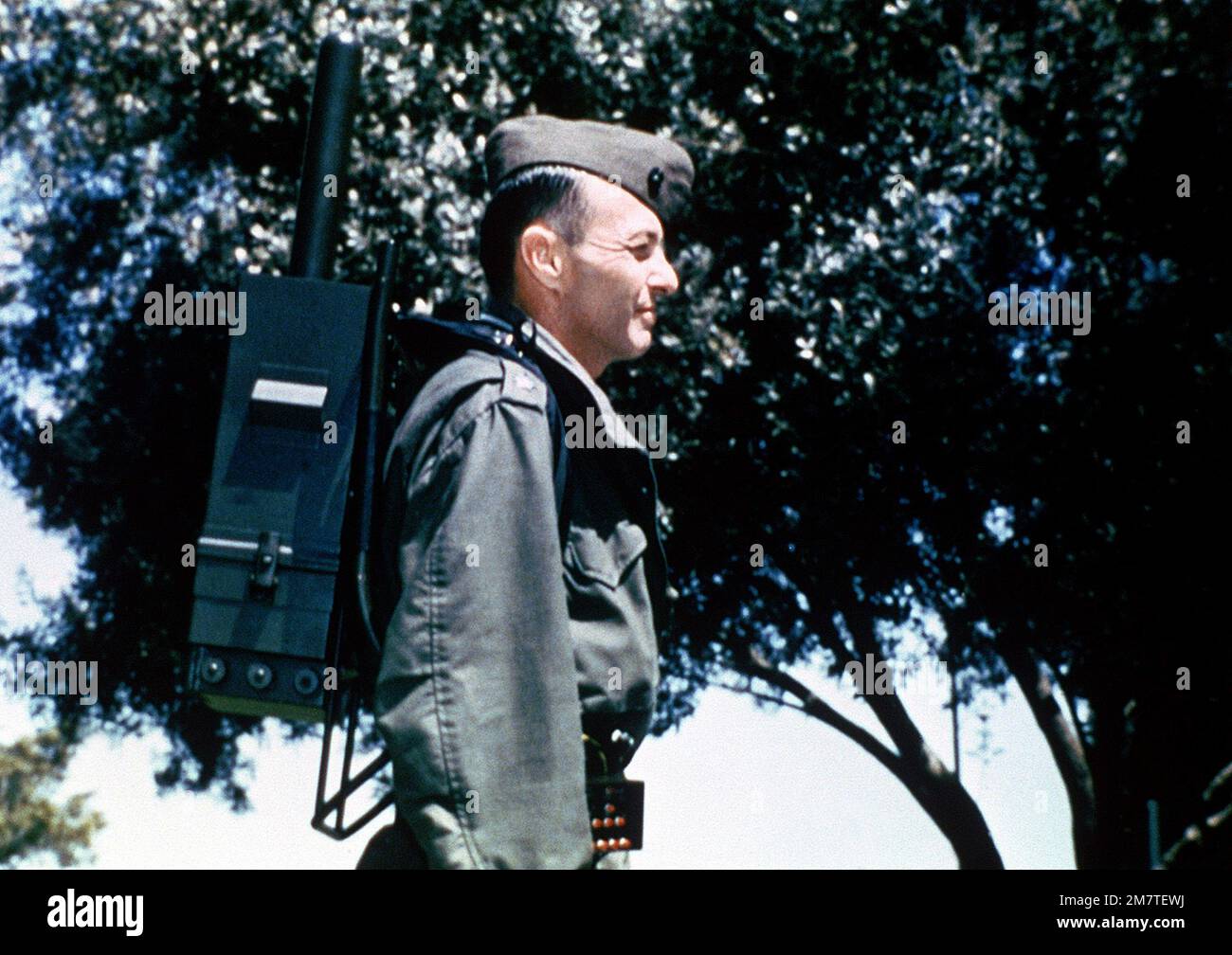 A Marine wears a backpack, part of the Navstar Global Positioning ...