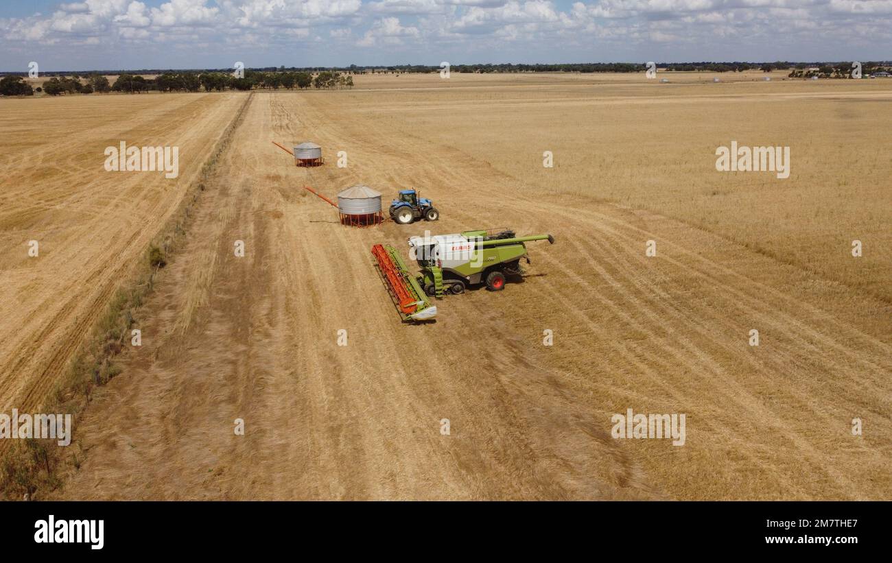 An aerial view of a Claas Lexion 760 combine harvester with two field