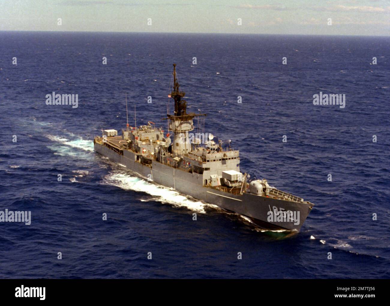 An aerial starboard bow view of the frigate USS KNOX (FF1052) underway