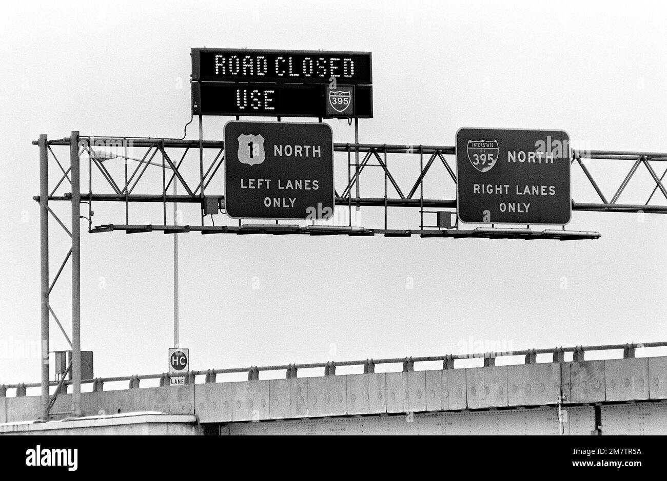 A view from the river of a sign informing commuters that Rochambeau Bridge (14th Street) will be closed during the recovery of victims and wreckage from Flight 90, the Air Florida Boeing 737 that crashed here. Base: Washington State: District Of Columbia (DC) Country: United States Of America (USA) Stock Photo