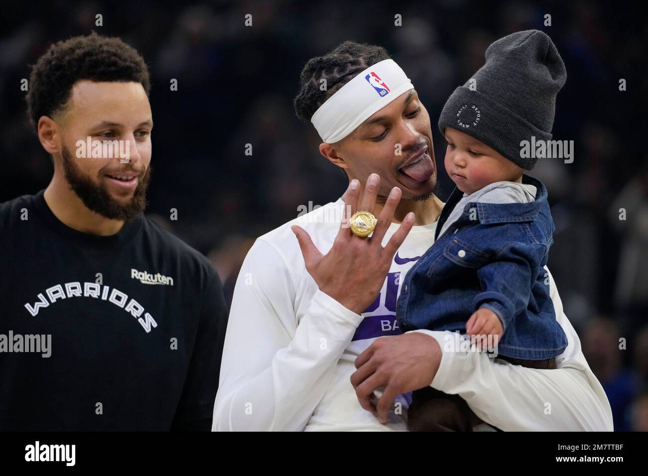 Golden State Warriors guard Stephen Curry, left, presents Phoenix Suns  guard Damion Lee with the 2021-2022 NBA Championship ring before an NBA  basketball game in San Francisco, Tuesday, Jan. 10, 2023. Lee