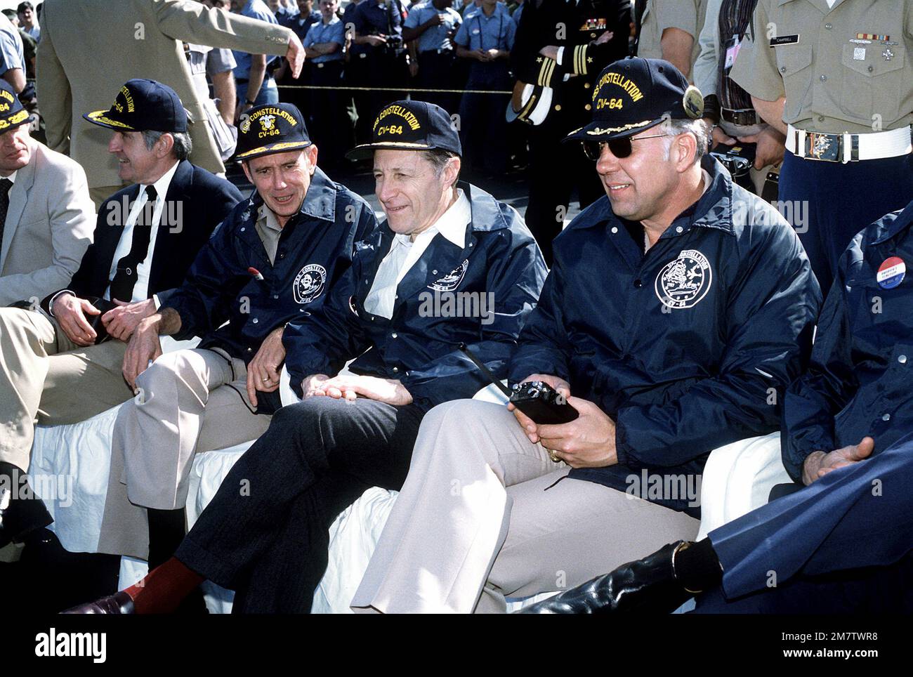 From right to left, CAPT D.M. Brooks, commanding officer, Secretary of ...