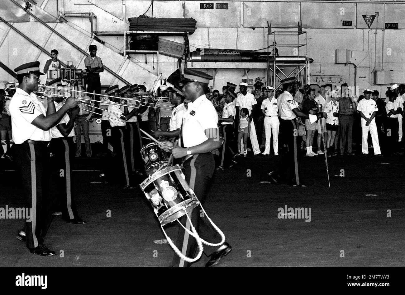 The Bahamian Royal Police band entertains crewmen aboard the aircraft