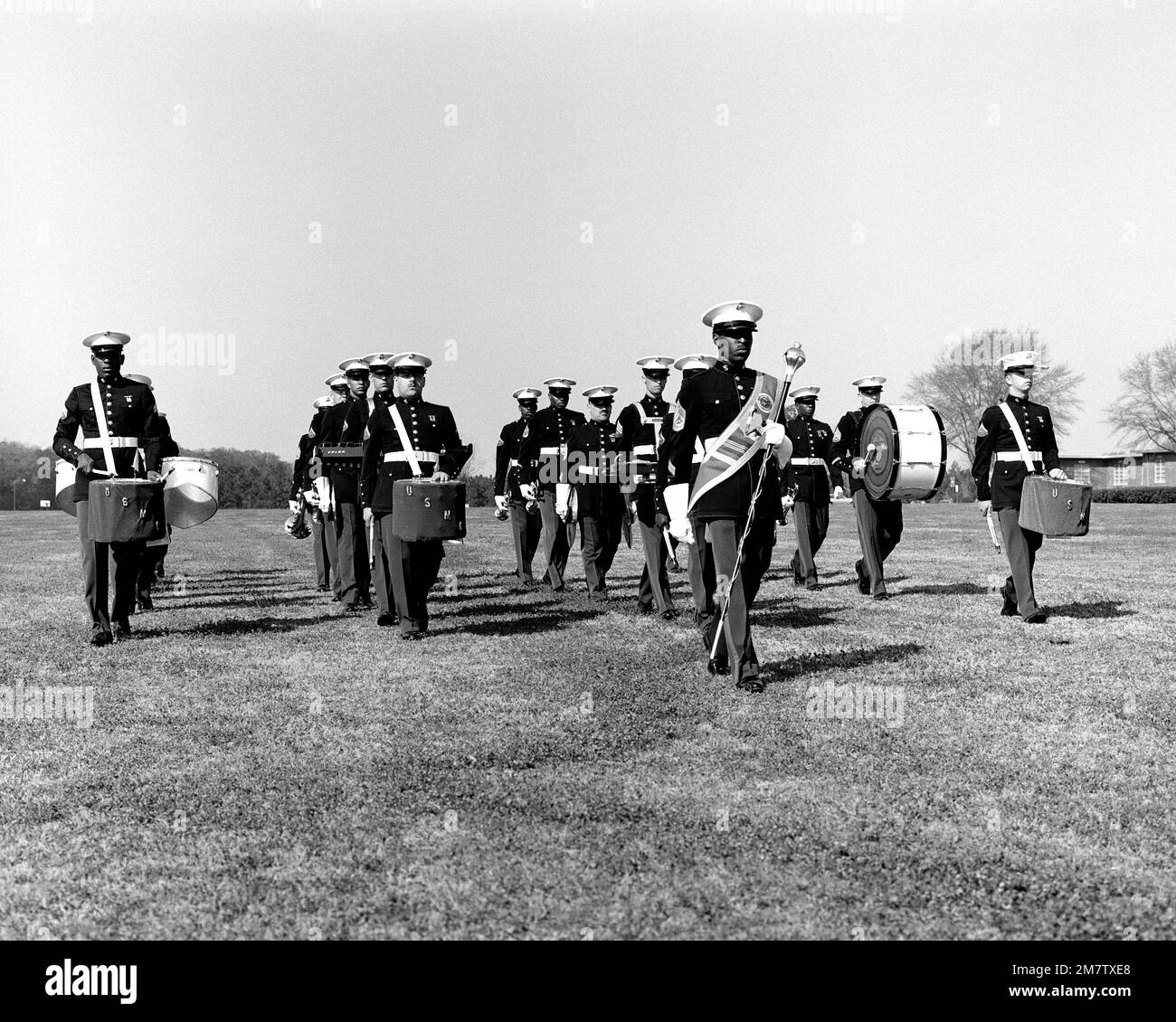 GUNNERY Sergeant J. A. Brown, drum major, leads the Marine Corps