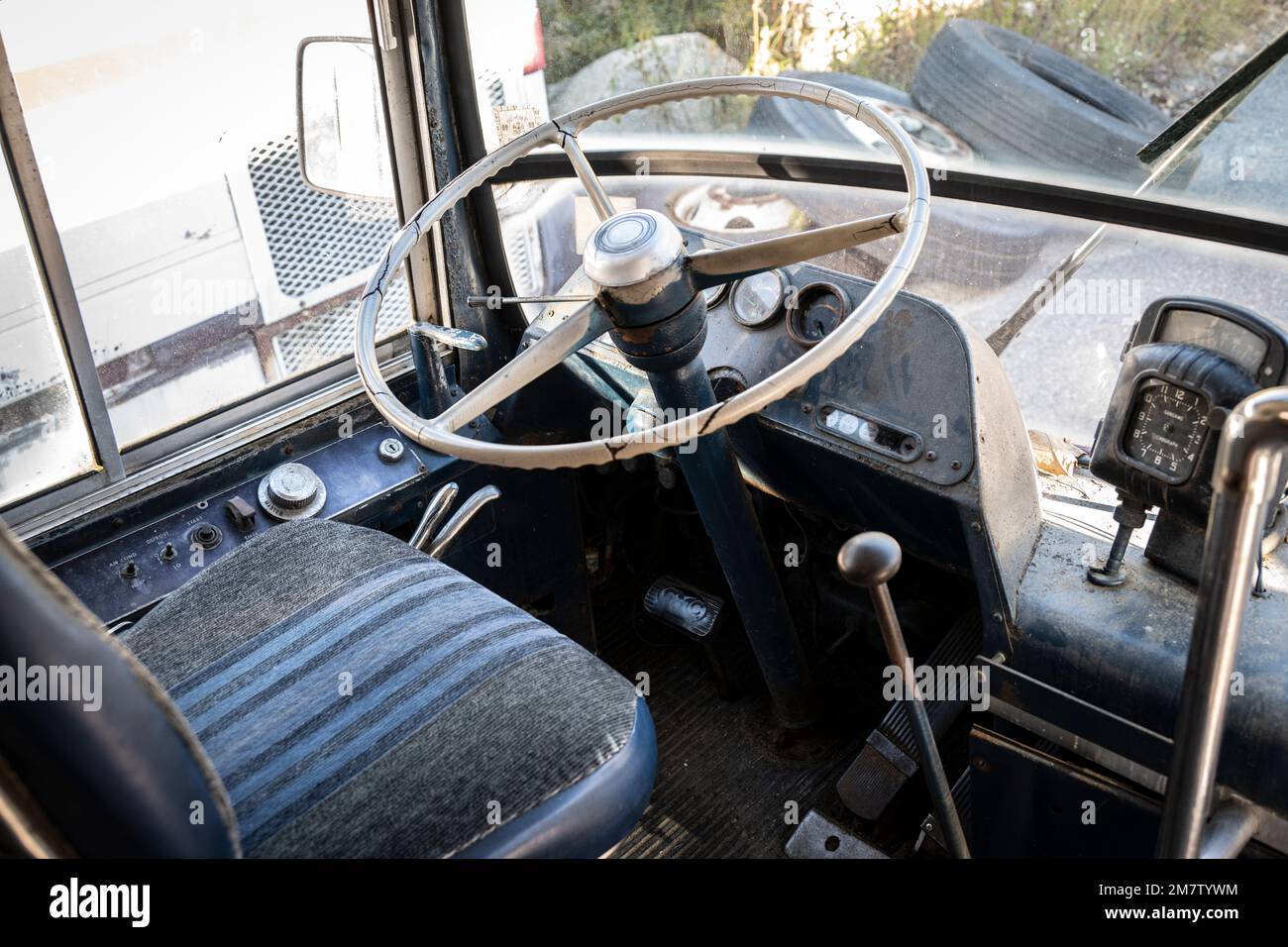 drivers steeringwheel and seat on old transit bus Stock Photo