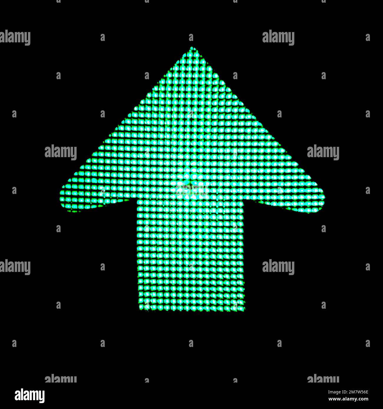 Right direction. Green arrow light on traffic lights on black