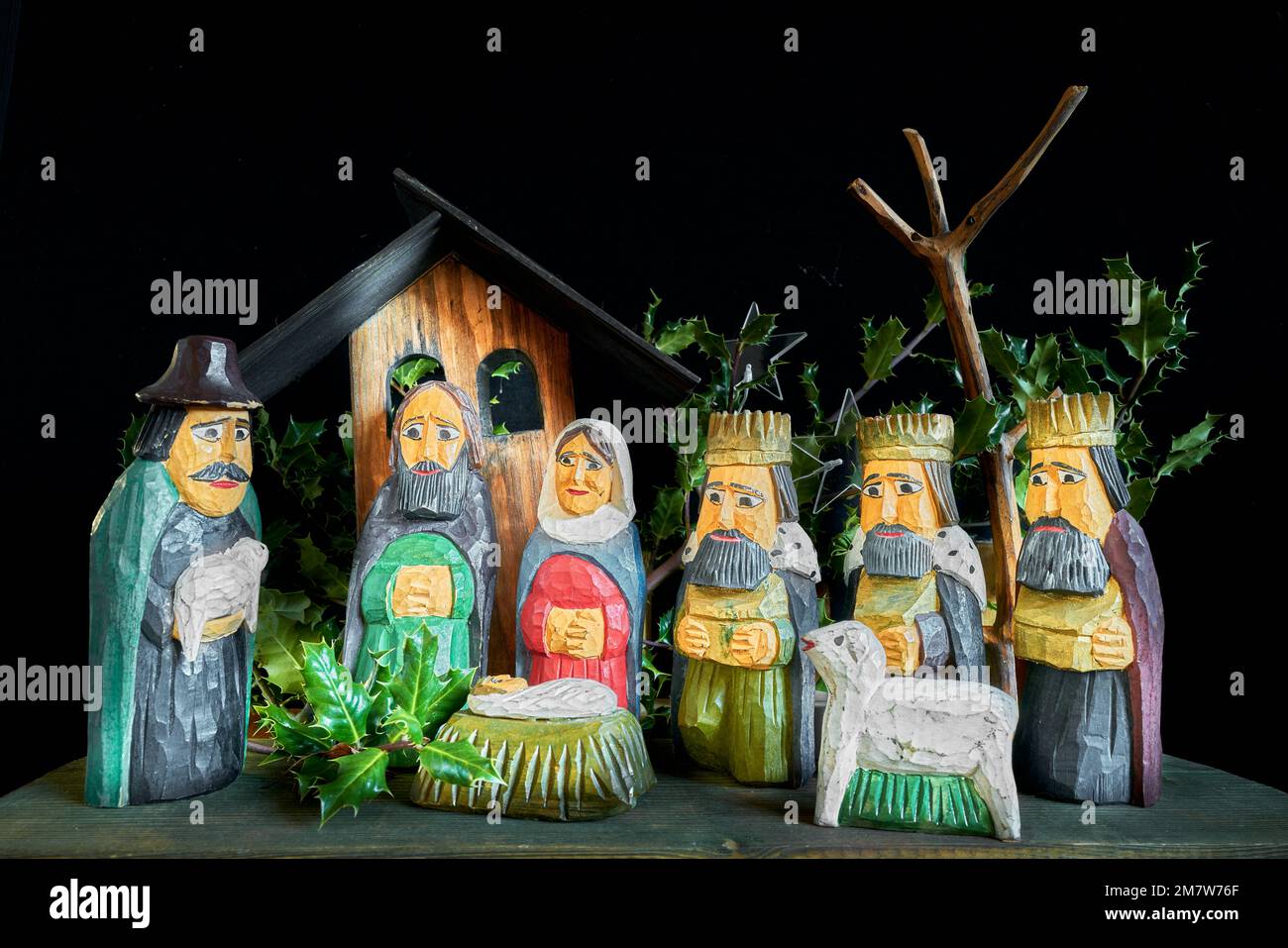 Crib - of a shepherd holding a lamb, and three magi holding gold frankincense and myrrh, gifts for the new-born Jesus Christ, son of Mary and Joseph. Stock Photo