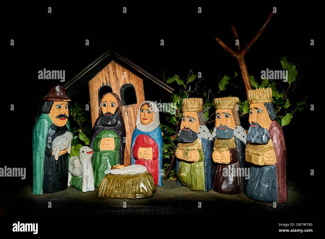 Crib - of a shepherd holding a lamb, and three magi holding gold frankincense and myrrh, gifts for the new-born Jesus Christ, son of Mary and Joseph. Stock Photo