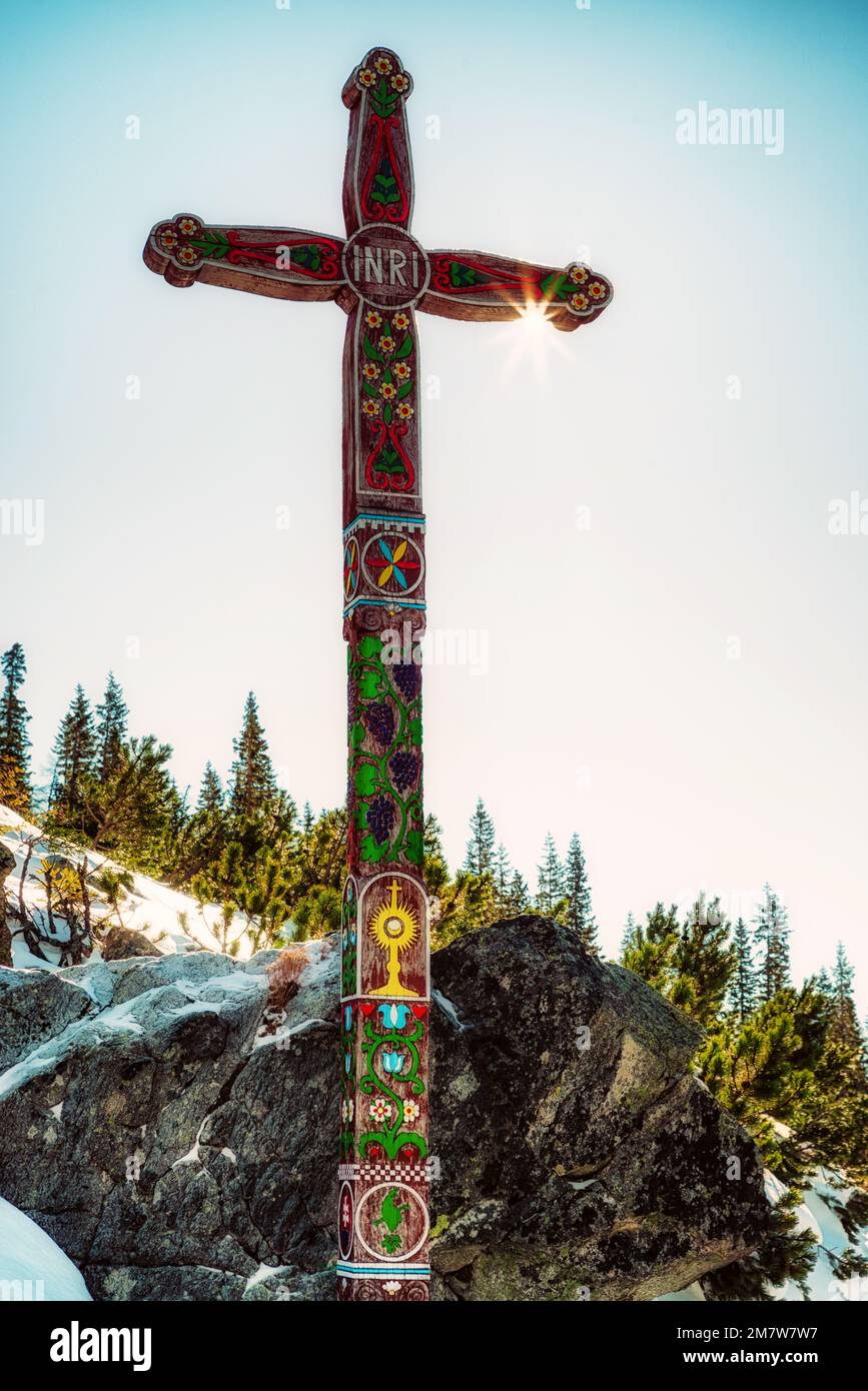 Popradske Pleso, Slovakia - January 21, 2017: Decorated wooden cross in monument Symbolic cemetery in High Tatras mountains in Slovakia. Stock Photo