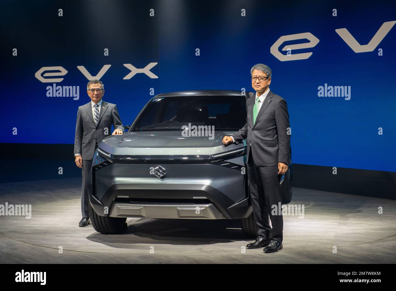 Greater Noida, India. 11th Jan, 2023. (L-R) Toshihiro Suzuki President Suzuki Motor Corp with Hisashi Takeuchi Managing Director of Maruti Suzuki pose with Concept car EVX SUV at the Auto Expo 2023 in Greater Noida. Credit: SOPA Images Limited/Alamy Live News Stock Photo