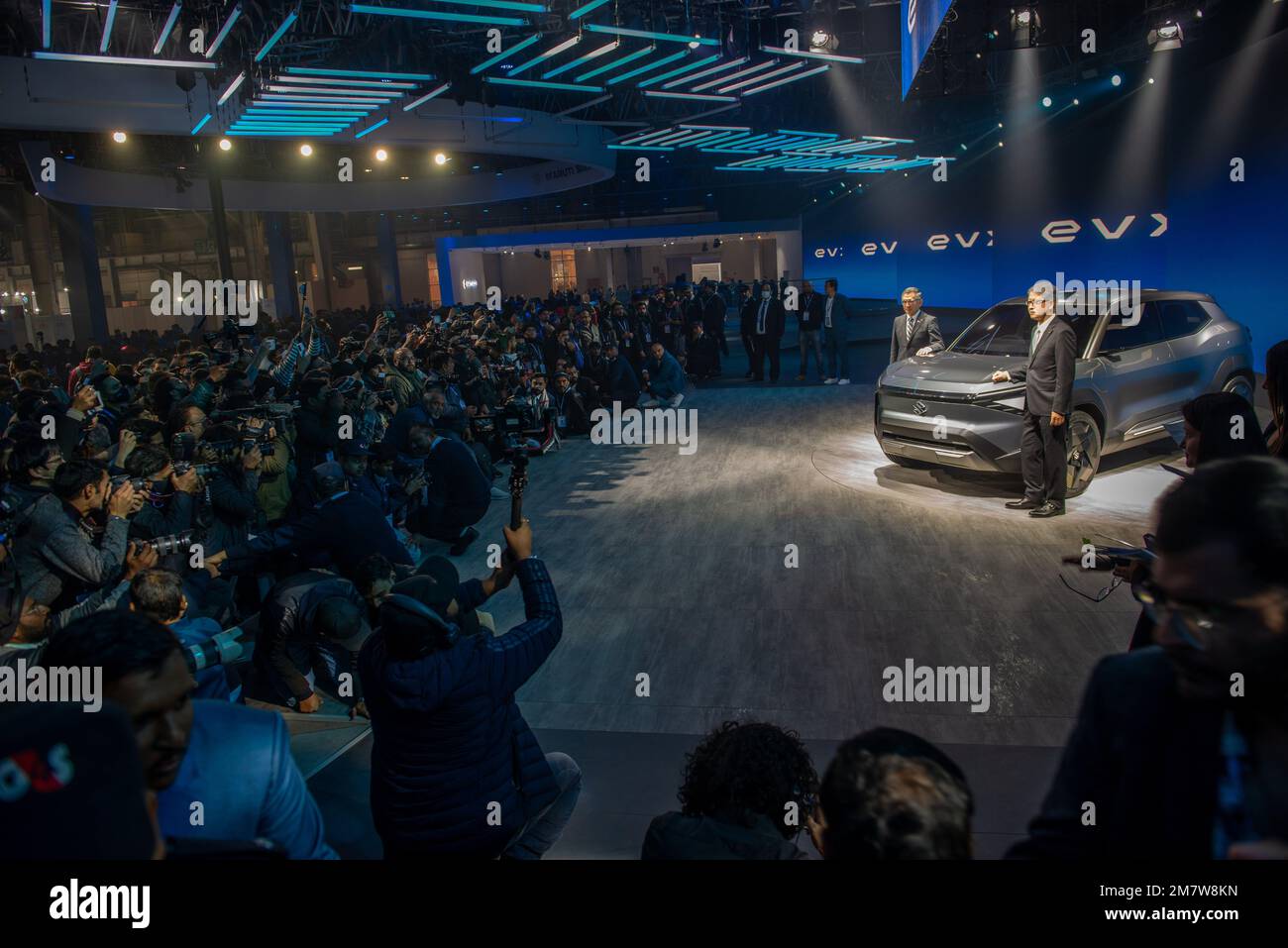 Greater Noida, India. 11th Jan, 2023. Media personals covering and recording as (L-R) Toshihiro Suzuki President Suzuki Motor Corp with Hisashi Takeuchi Managing Director of Maruti Suzuki pose with Concept car EVX SUV at the Auto Expo 2023 in Greater Noida. Credit: SOPA Images Limited/Alamy Live News Stock Photo