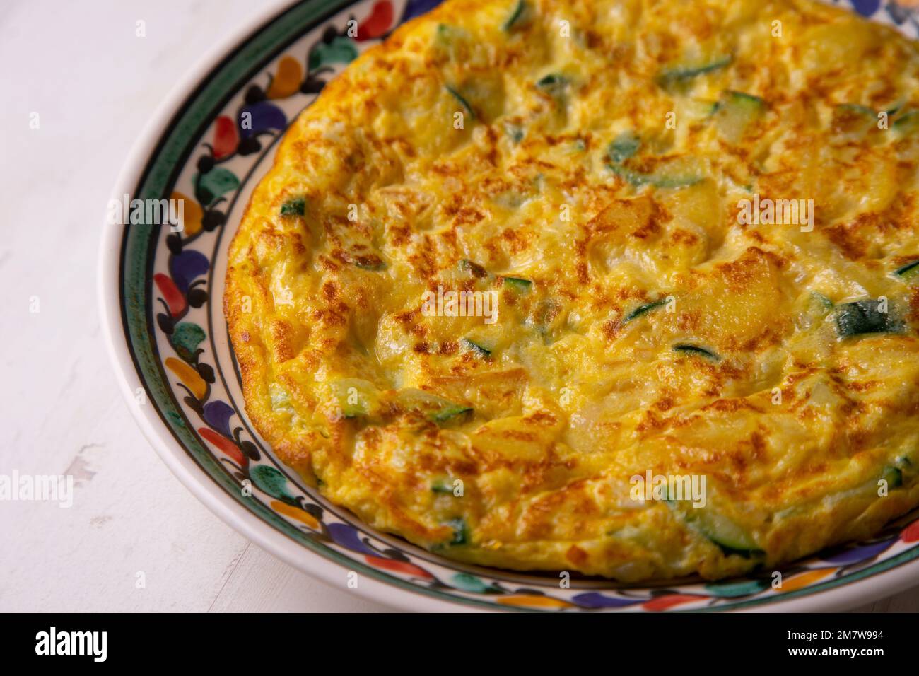 Zucchini potato omelette. The potato omelette, or Spanish omelette is an omelette or omelette to which chopped potatoes are added. Stock Photo