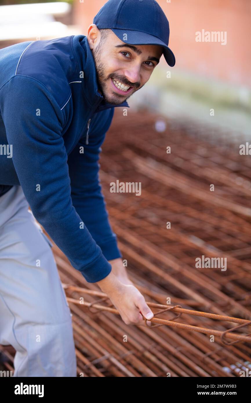 builder in blue uniform checking the foundation Stock Photo
