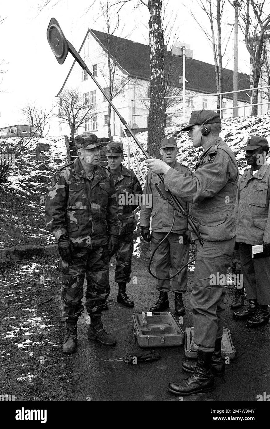 From left to right, SGM of the Army William A. Connelly, CSM Seals, Barker and Gore watch as SPC Delta explains the method of how to use a mine detector. Base: Wildflecken Country: West Germany (FRG) Stock Photo