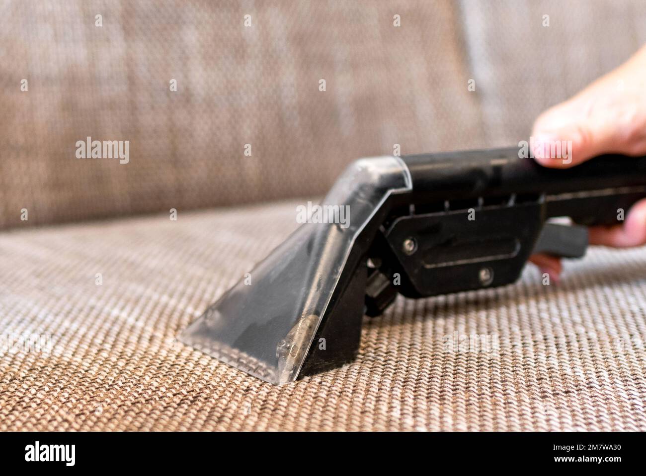 Sofa cleaning with professional steam cleaner Stock Photo Alamy