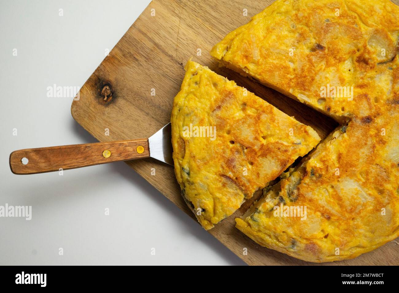 The potato omelette, or Spanish omelette is an omelette or omelette to which chopped potatoes are added. Stock Photo