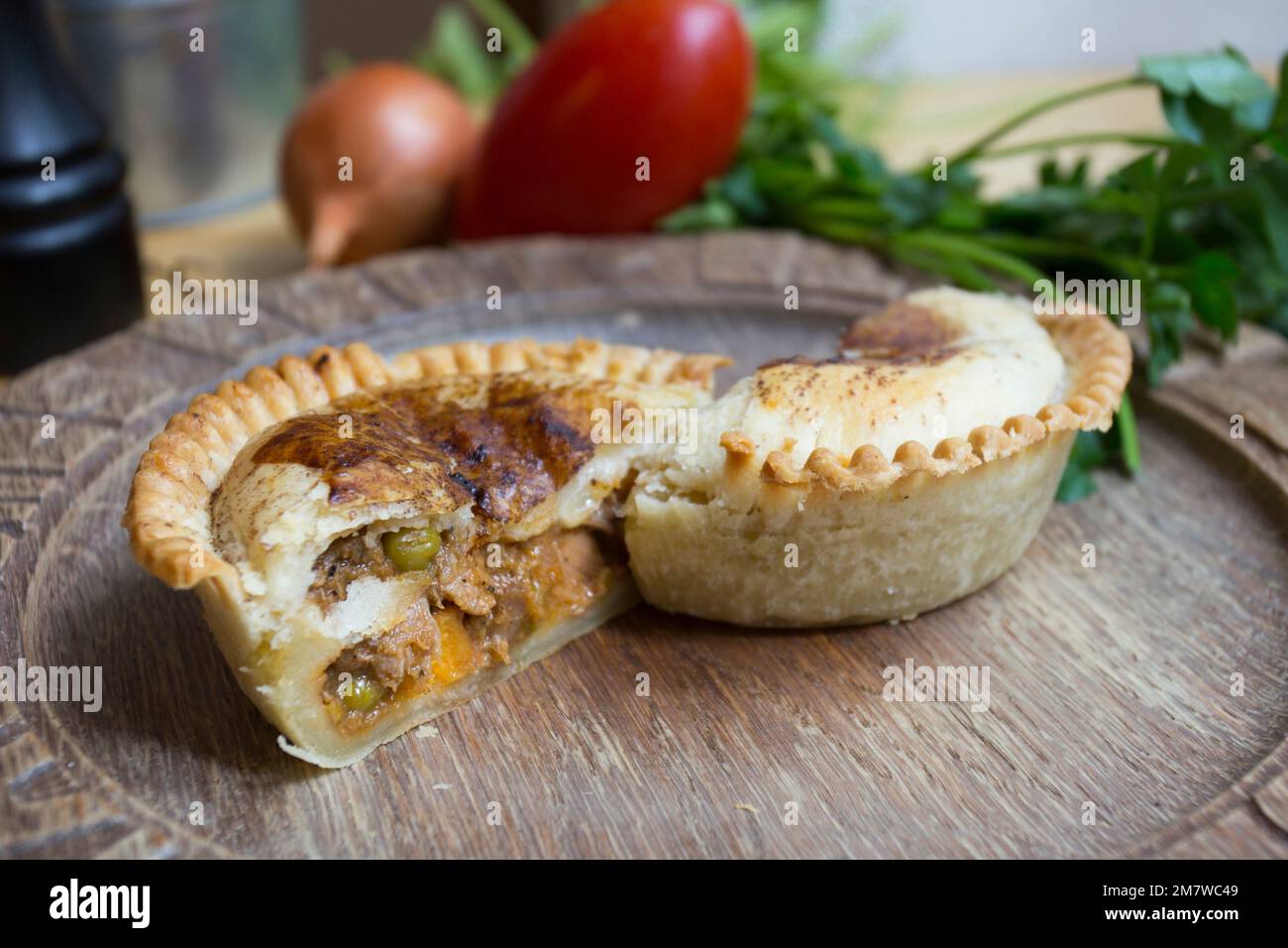 British ale steak Pie. Tender pieces of steak are cooked with vegetables and English ale, then wrapped in a flaky buttery crust. Stock Photo