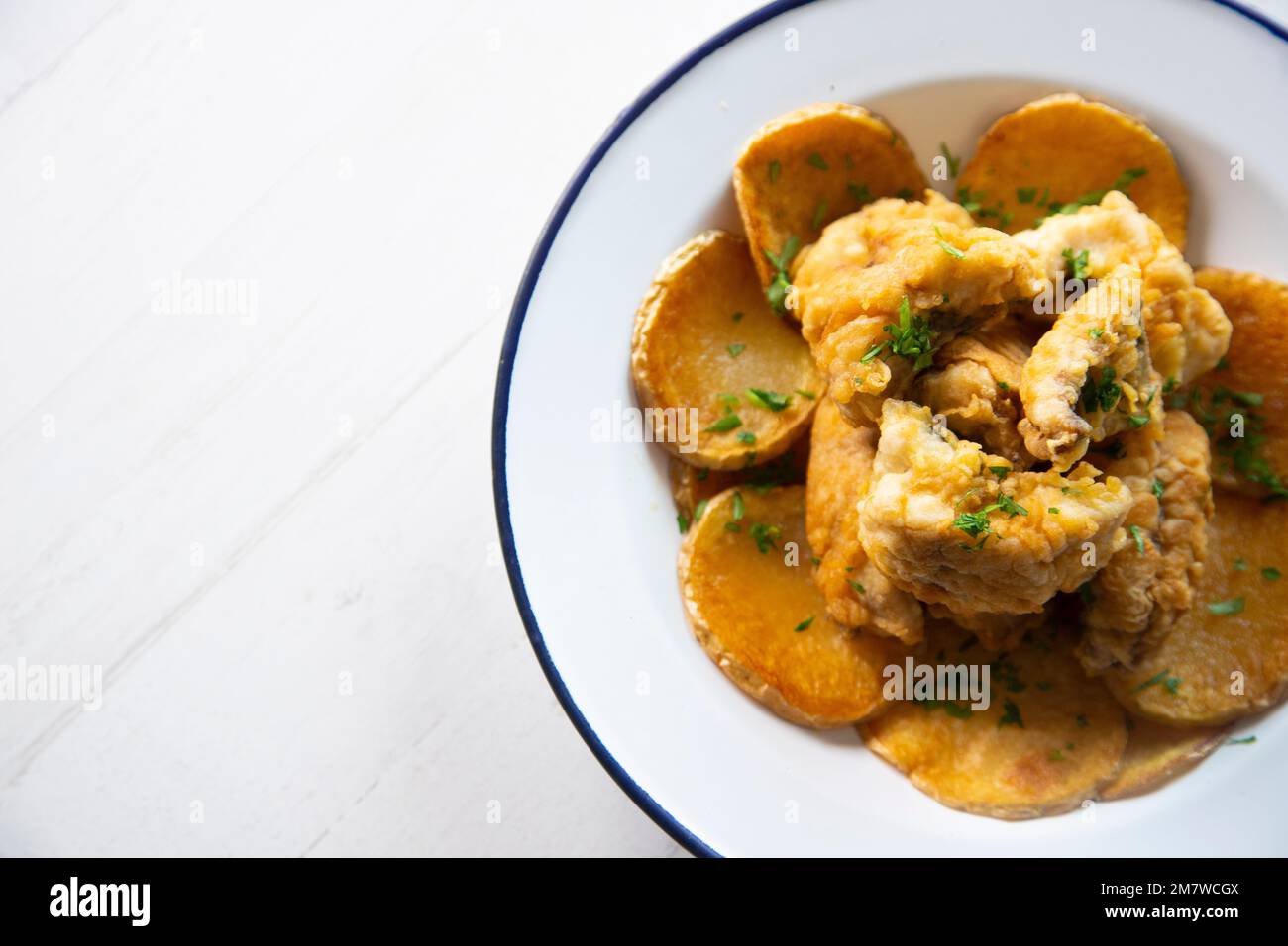 Battered mackerel fish and chips with potatoes Stock Photo Alamy