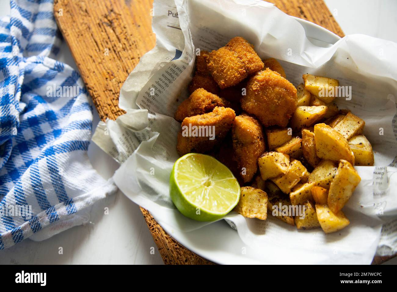 Battered mackerel fish and chips with potatoes Stock Photo Alamy