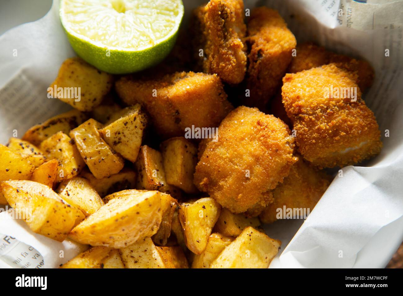 Battered mackerel fish and chips with potatoes Stock Photo Alamy